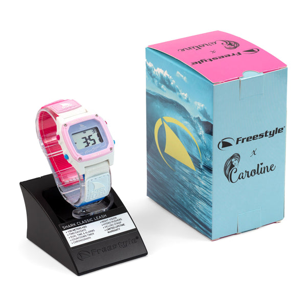 Freestyle Caroline Marks Signature Shark Classic Leash Daydream watch displayed on a stand beside its blue and pink box.